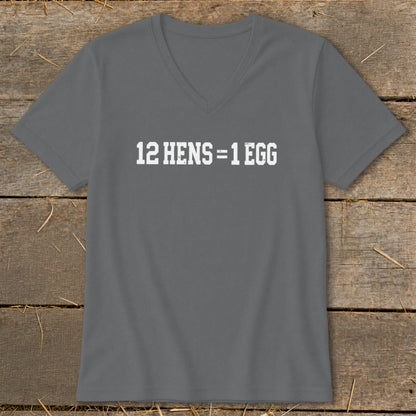 Dark gray V-neck t-shirt featuring the white text 12 HENS = 1 EGG displayed on the chest, lying flat on a wooden surface.