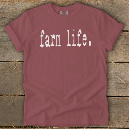 Red t-shirt with "farm life." printed in white distressed text.