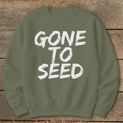 Olive green sweatshirt with white distressed text "GONE TO SEED".