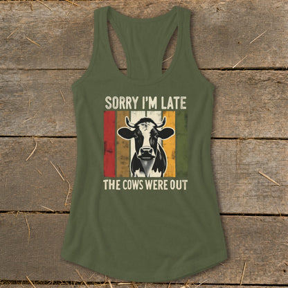 Green tank top with cow graphic and text "Sorry I'm Late The Cows Were Out".