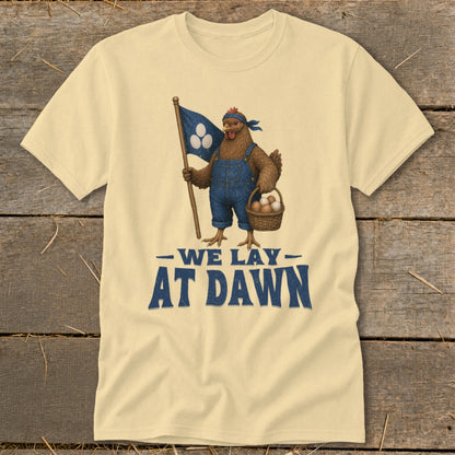 Chicken in overalls holding flag with eggs and basket of eggs, text "WE LAY AT DAWN".