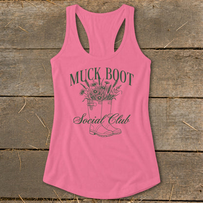 Pink tank top with "Muck Boot Social Club" text and illustration of boots with flowers.