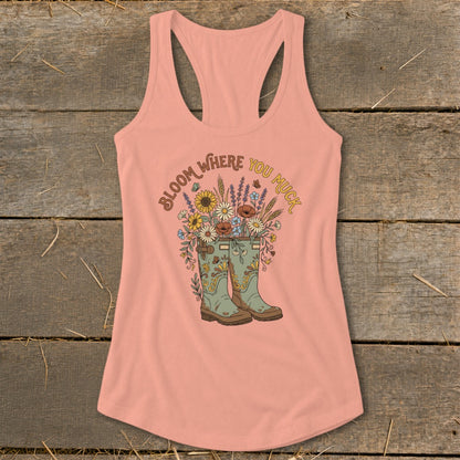 Peach tank top with boots and flowers graphic reading "Bloom Where You Muck".
