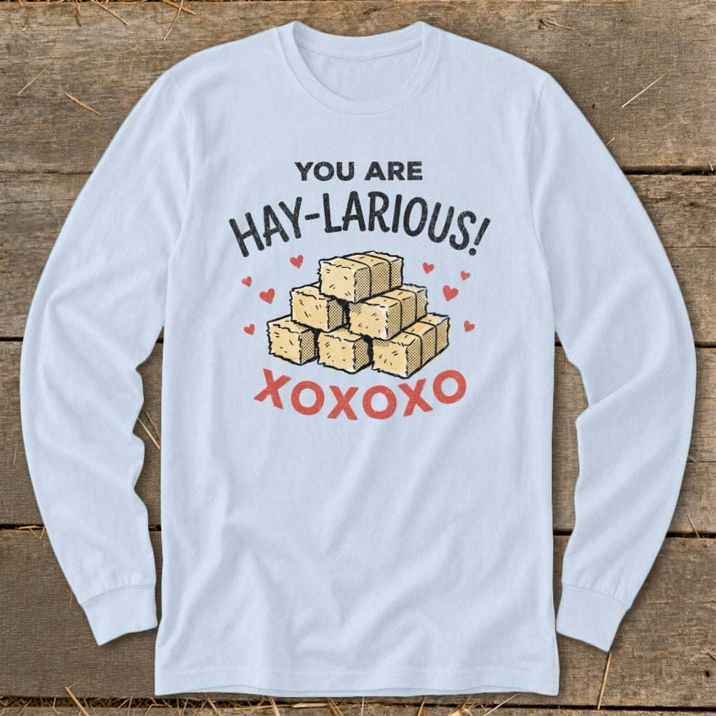 Light blue long-sleeve shirt with "You Are Hay-Larious!" and hay bales.