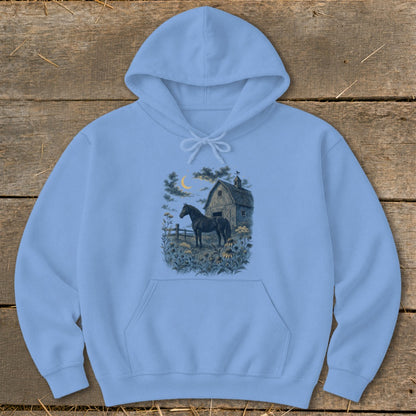 Light blue hoodie with a graphic of a horse in a field at night near a barn.