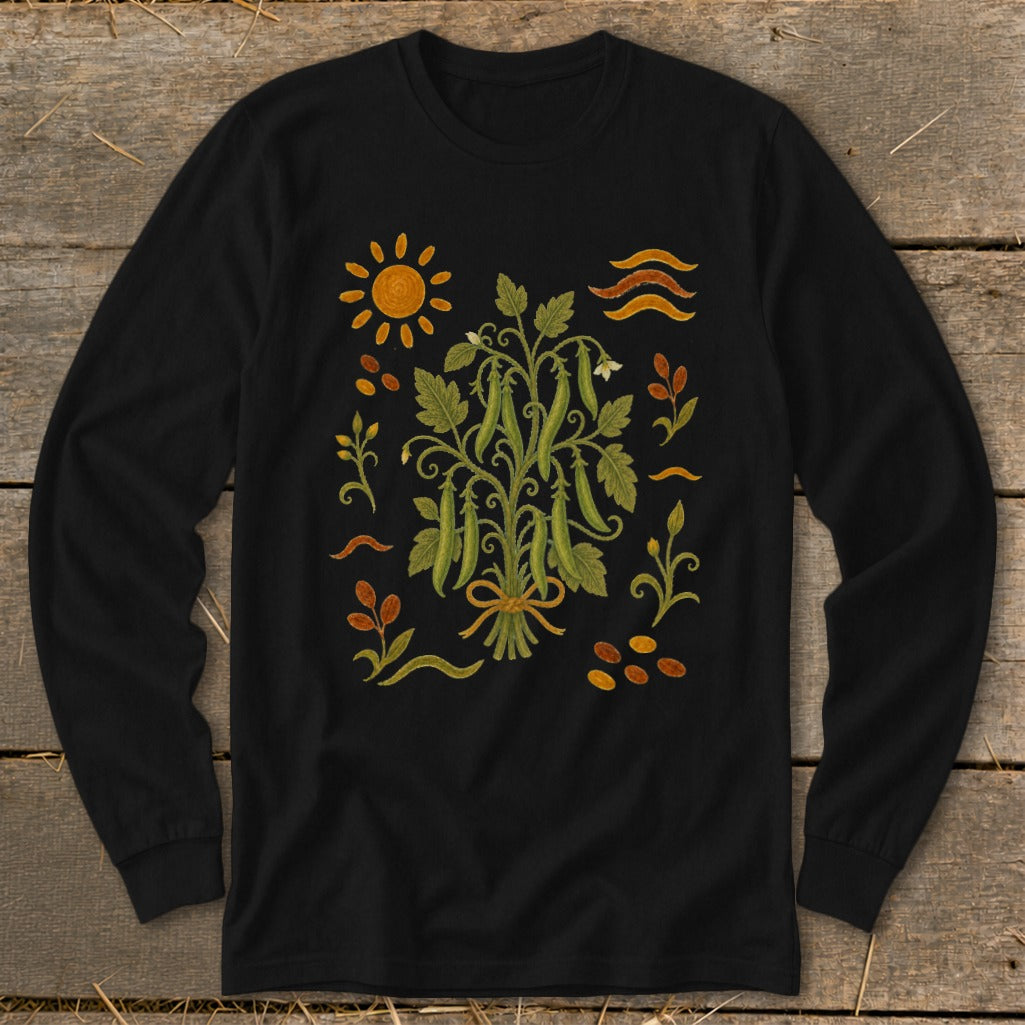 Black long-sleeve shirt with a botanical illustration of peas, sun, and decorative elements.