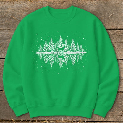 Green sweatshirt with white winter forest scene featuring a deer and reflection.