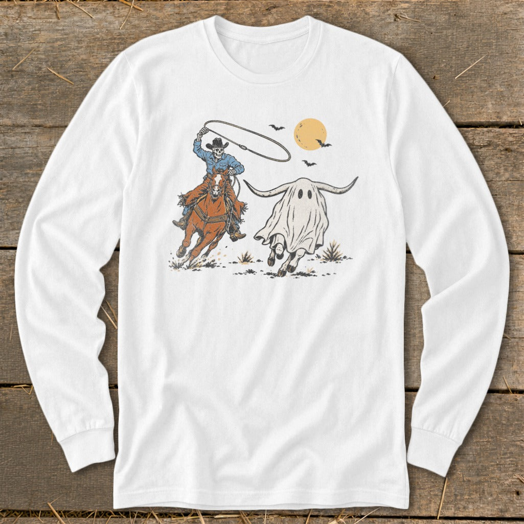 Skeleton cowboy on horseback lassoing a bull-horned ghost with bats and moon.