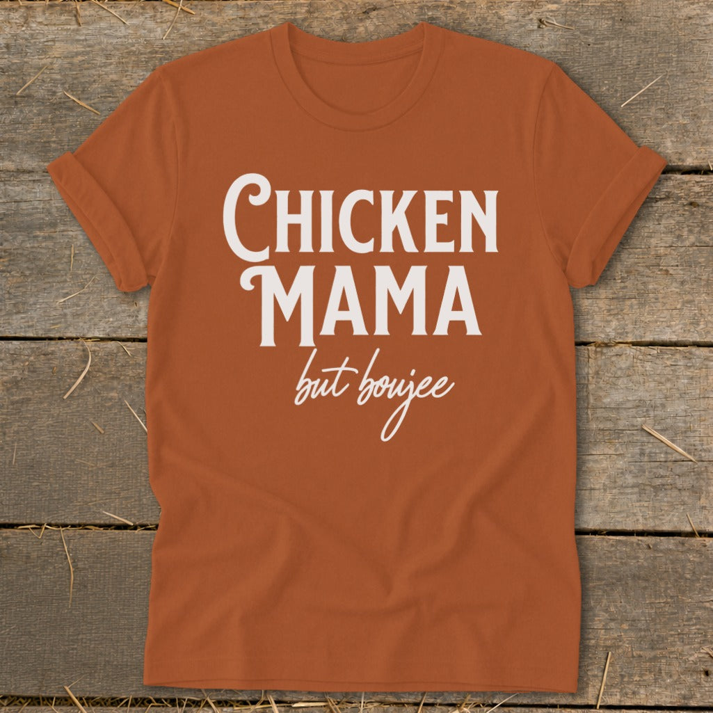 Orange t-shirt with white text "Chicken Mama but boujee"
