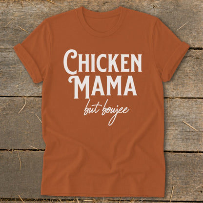 Orange t-shirt with white text "Chicken Mama but boujee"