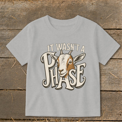 Light gray t-shirt with a goat head graphic and text "IT WASN'T A PHASE".