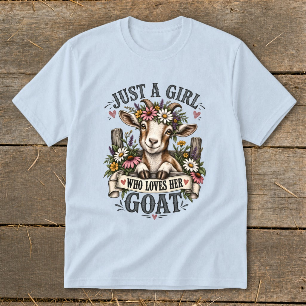 Light blue t-shirt with graphic of a goat wearing flowers and text "Just a girl who loves her goat".
