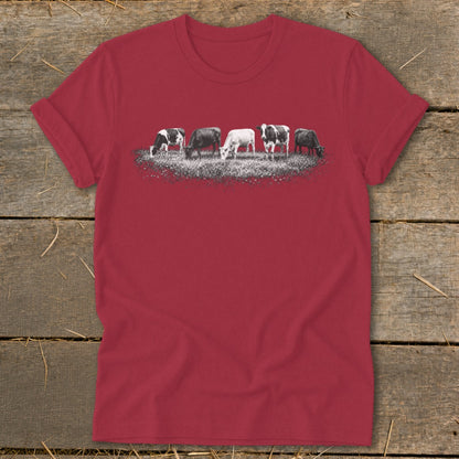 Red t-shirt with a graphic of five cows grazing in a field.