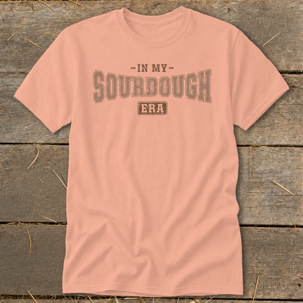 Peach t-shirt with "IN MY SOURDOUGH ERA" text in distressed brown lettering.