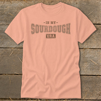 Peach t-shirt with "IN MY SOURDOUGH ERA" text in distressed brown lettering.