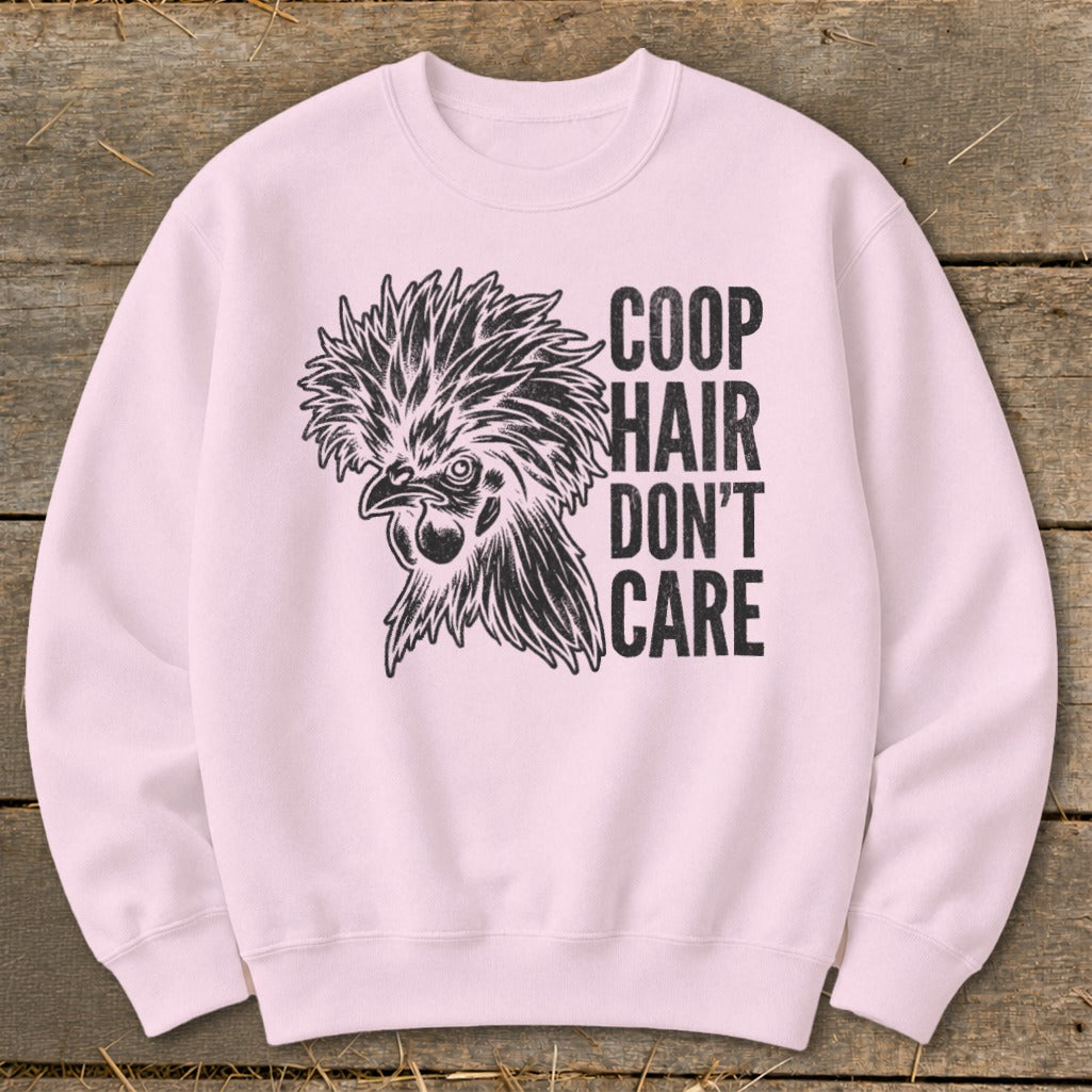 Pink crewneck sweatshirt with a black graphic of a stylized chicken and the text "COOP HAIR DON'T CARE".