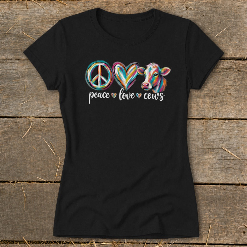 Black t-shirt with "peace love cows" text and colorful peace sign, heart, and cow graphic.