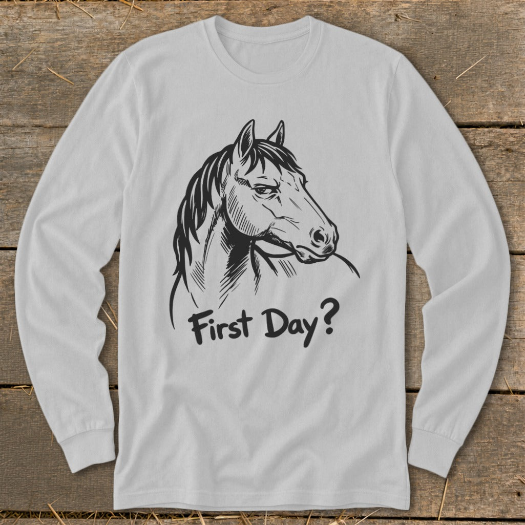 White long-sleeve shirt with a black sketch of a horse and the text "First Day?".