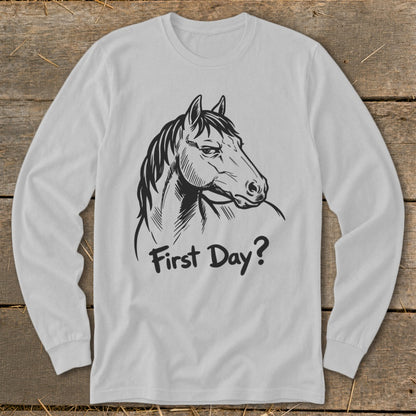 White long-sleeve shirt with a black sketch of a horse and the text "First Day?".