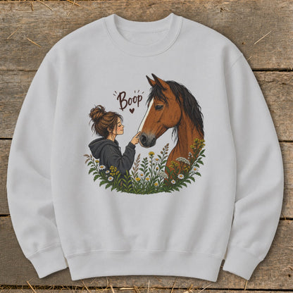Illustration of a girl touching a horse's nose with "Boop" text above.