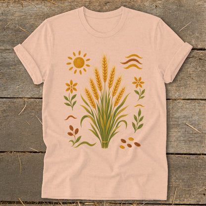 T-shirt with a graphic of wheat stalks, sun, flowers, and seeds.
