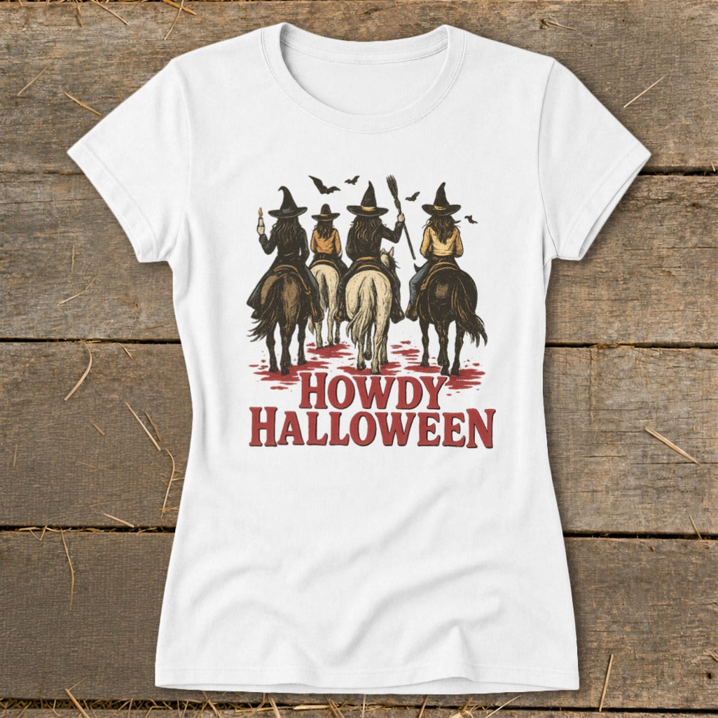Four witches on horses with the text "Howdy Halloween" below.