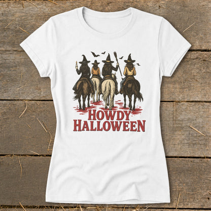 Four witches on horses with the text "Howdy Halloween" below.