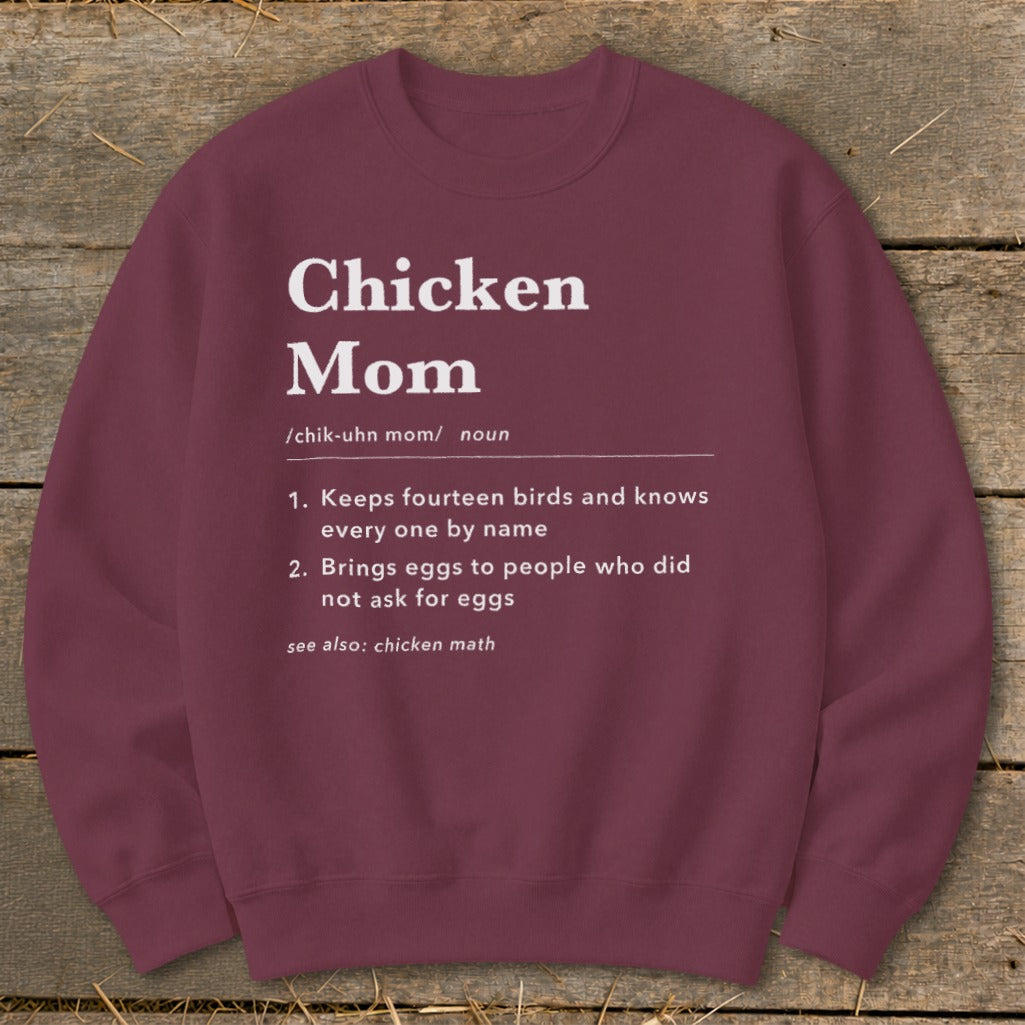 Maroon sweatshirt with "Chicken Mom" definition including keeping birds and bringing eggs.
