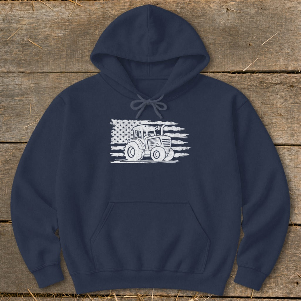 Navy hoodie with white distressed American flag and tractor graphic.