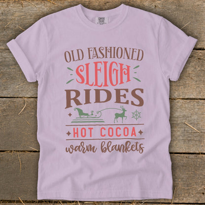 T-shirt with "Old Fashioned Sleigh Rides, Hot Cocoa, Warm Blankets" text and winter graphics.