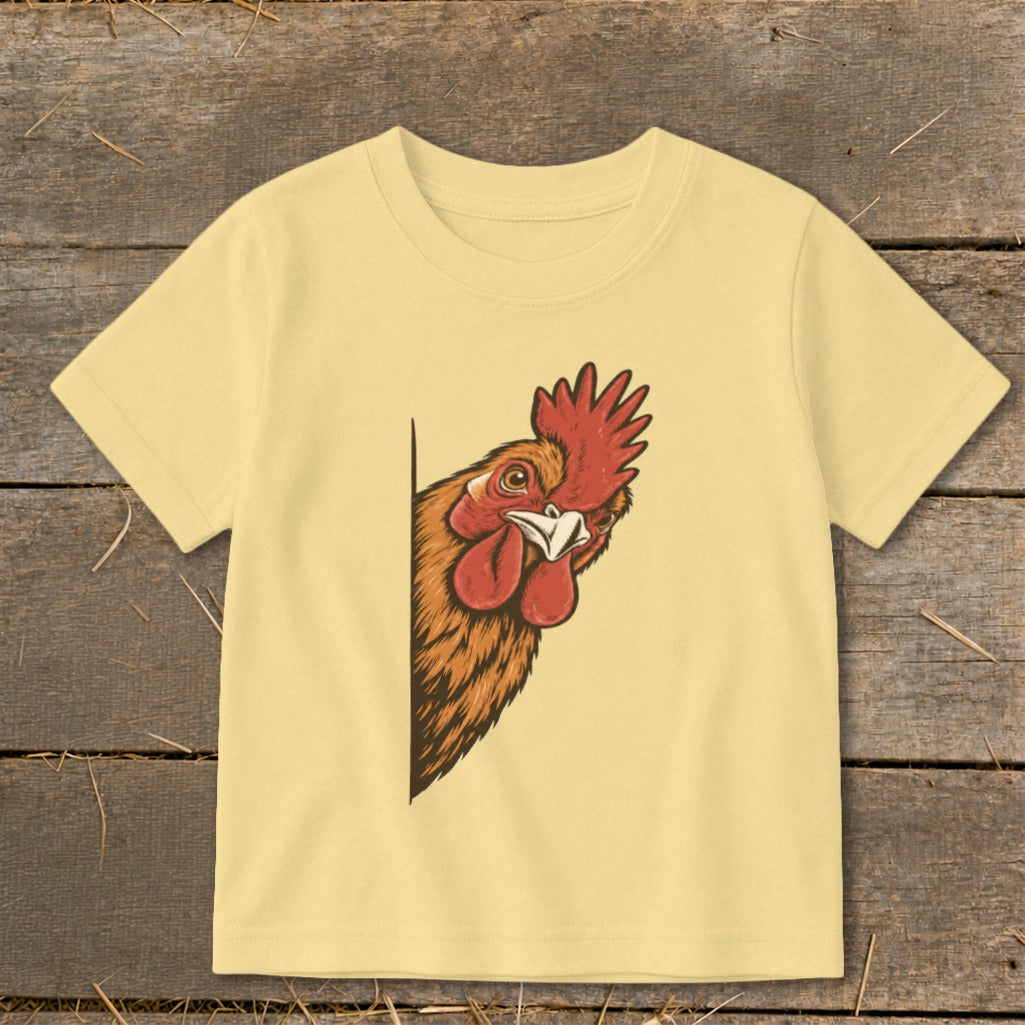 Light yellow t-shirt with a peeking rooster illustration on the front.