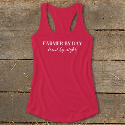 Fuchsia tank top with "FARMER BY DAY tired by night" text.