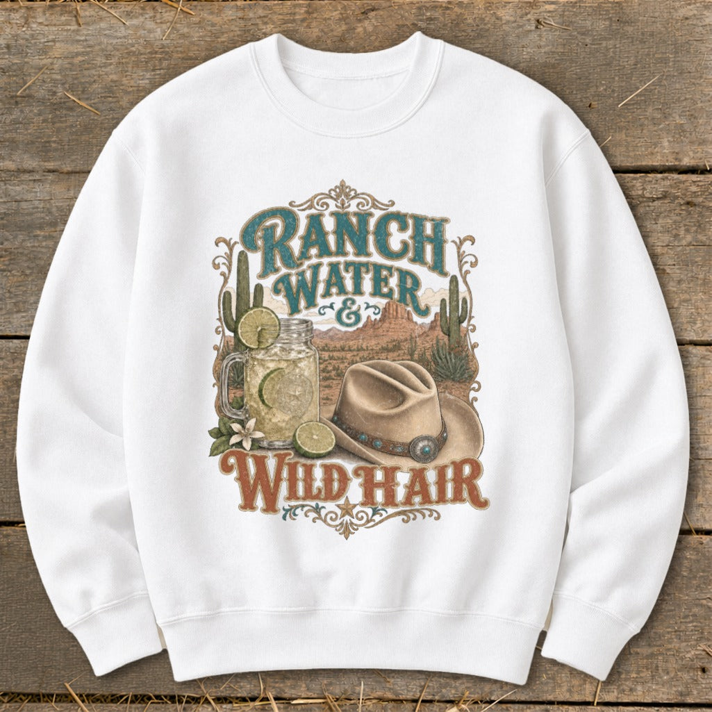 White sweatshirt with "Ranch Water & Wild Hair" graphic featuring a drink, cowboy hat, and desert scene.