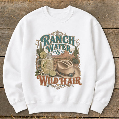 White sweatshirt with "Ranch Water & Wild Hair" graphic featuring a drink, cowboy hat, and desert scene.