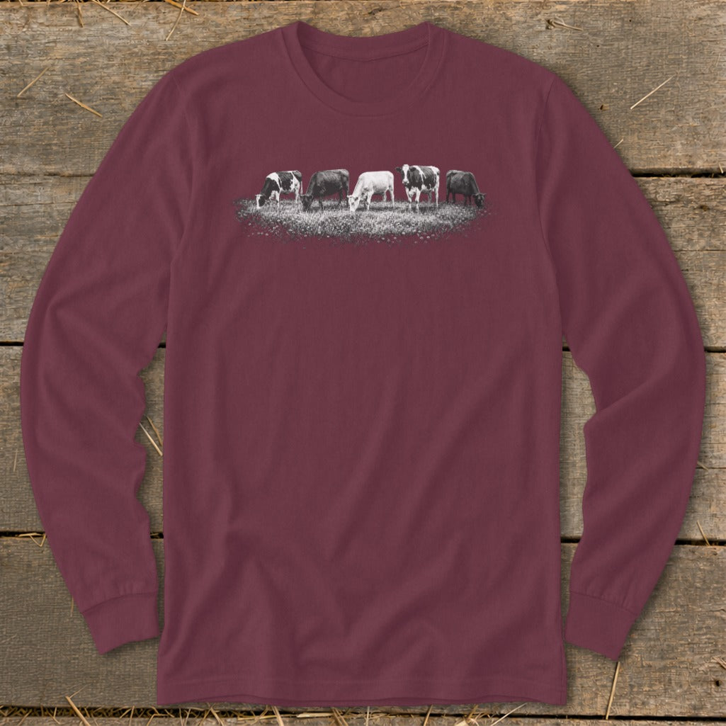 Maroon long-sleeve t-shirt with a graphic of five cows grazing in a field.