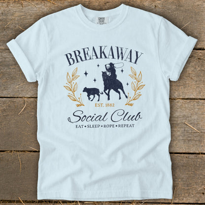 White t-shirt with "Breakaway Social Club" graphic featuring a cowboy and calf.