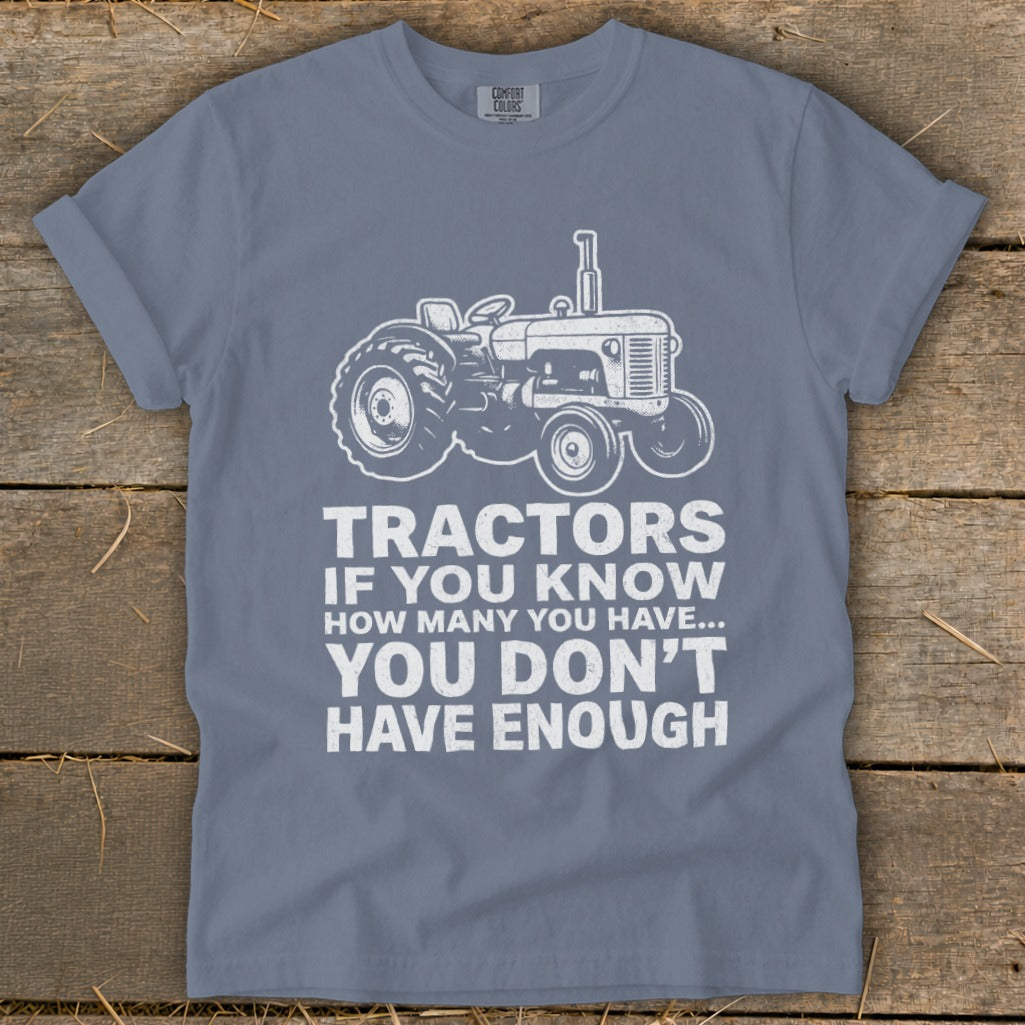 Gray t-shirt with a white tractor graphic and the text "Tractors If You Know How Many You Have... You Don't Have Enough."