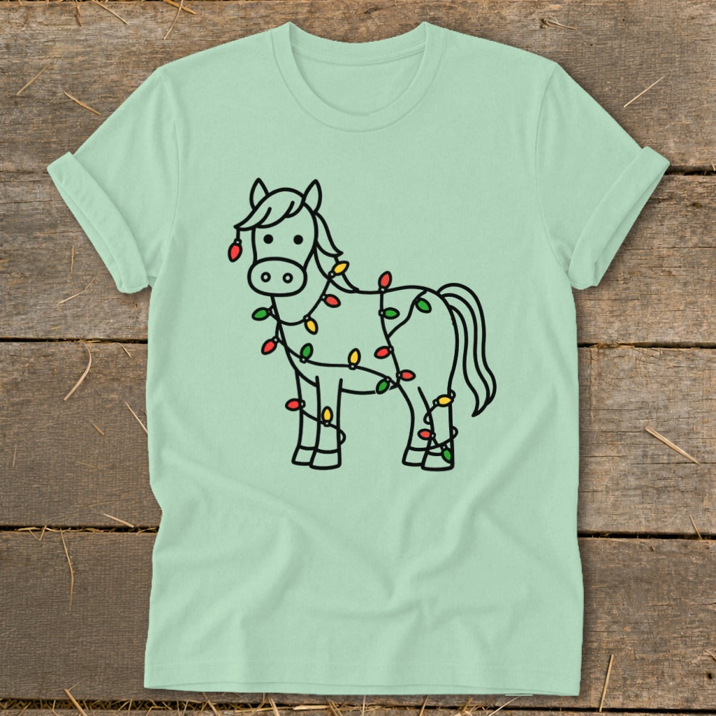 Light green t-shirt with a line drawing of a horse decorated with Christmas lights.