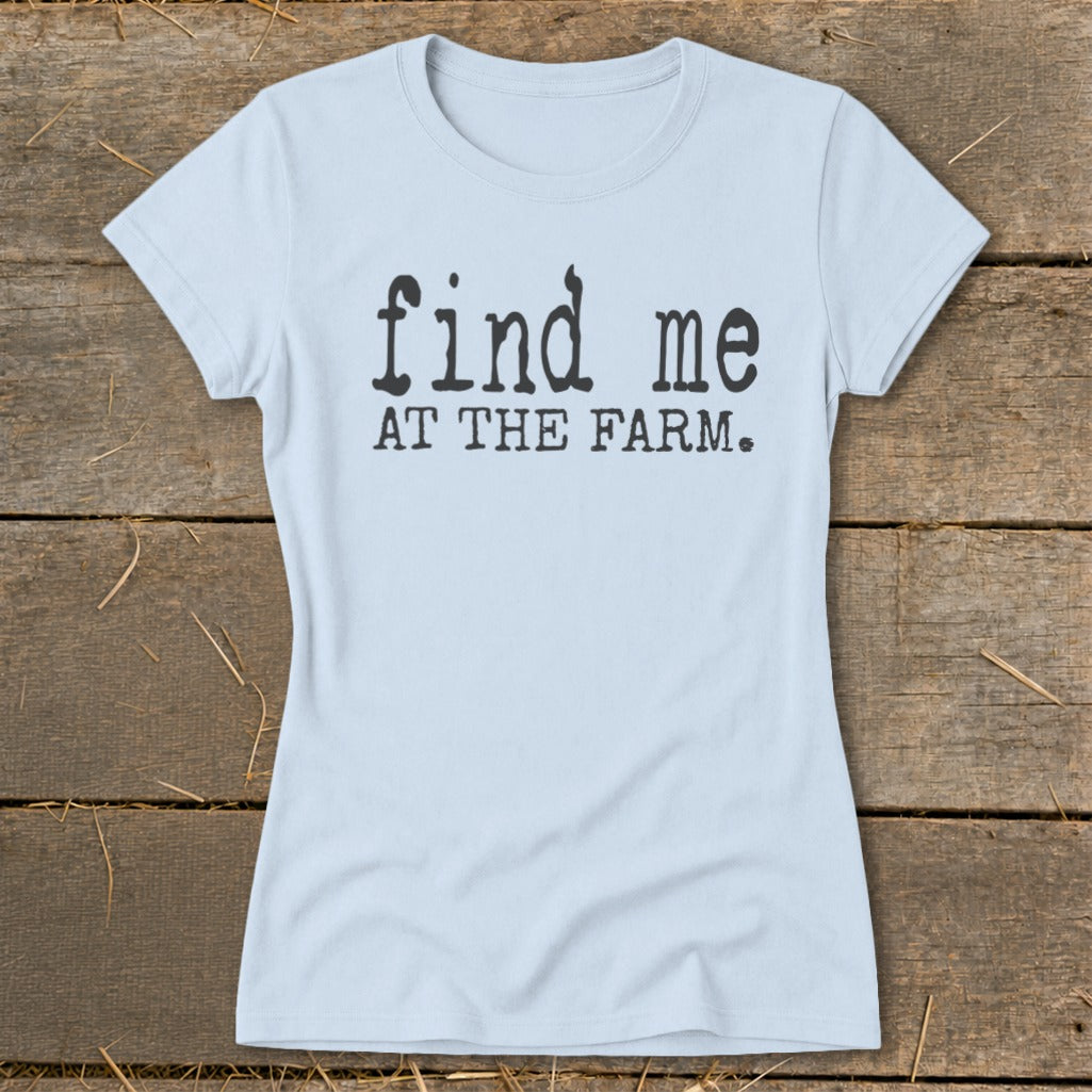 Light blue t-shirt with black text that reads "find me AT THE FARM."