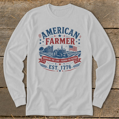 American Farmer graphic on white long-sleeve shirt with tractor and barn.