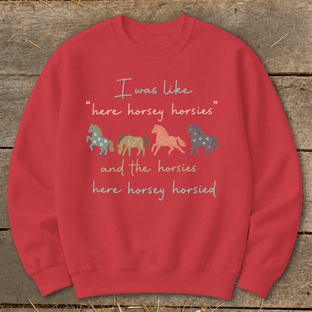 Red sweatshirt with four cartoon horses and humorous text about horses.