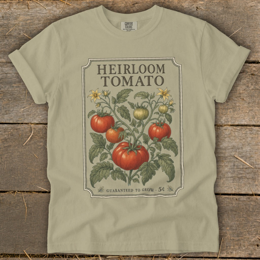 T-shirt with heirloom tomato plant design and text "GUARANTEED TO GROW".