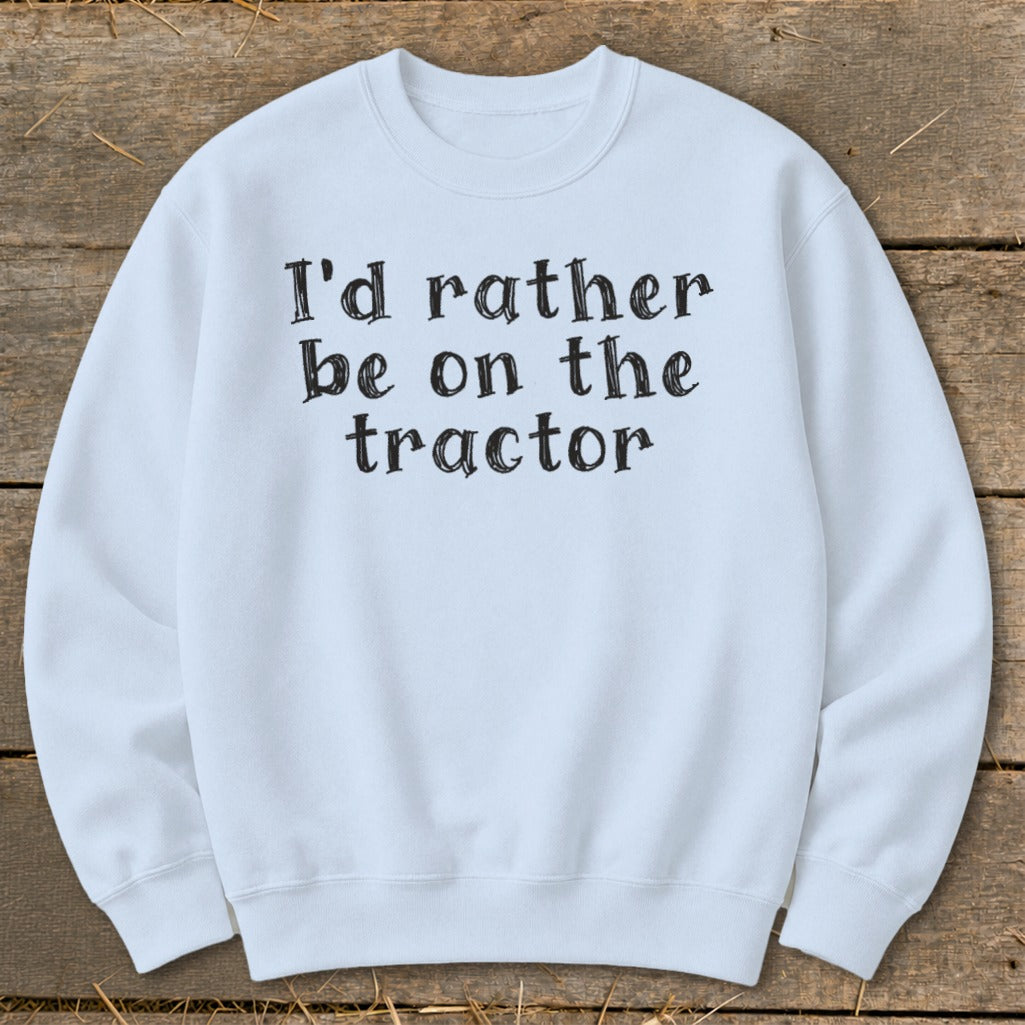 Light blue sweatshirt with "I'd rather be on the tractor" printed in black.