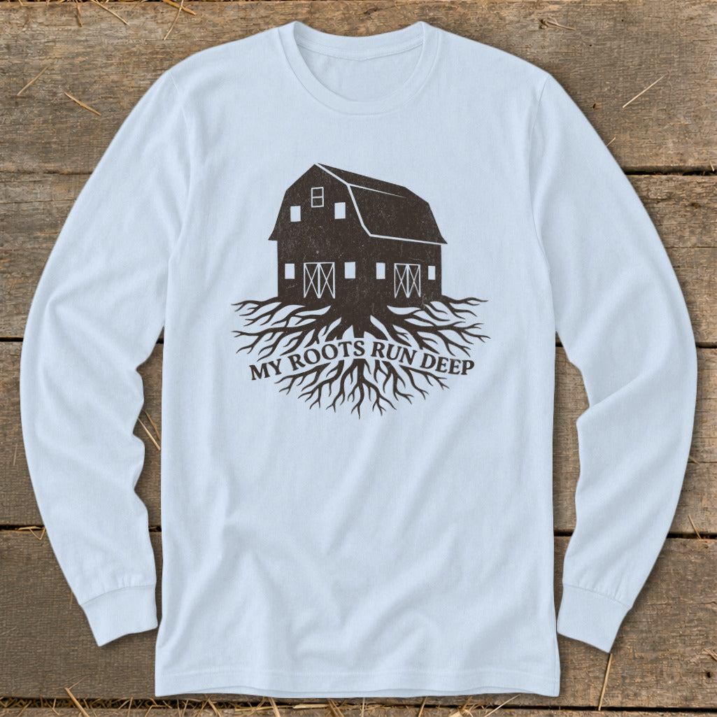 Long sleeve shirt with a dark brown barn and roots graphic, text "MY ROOTS RUN DEEP".