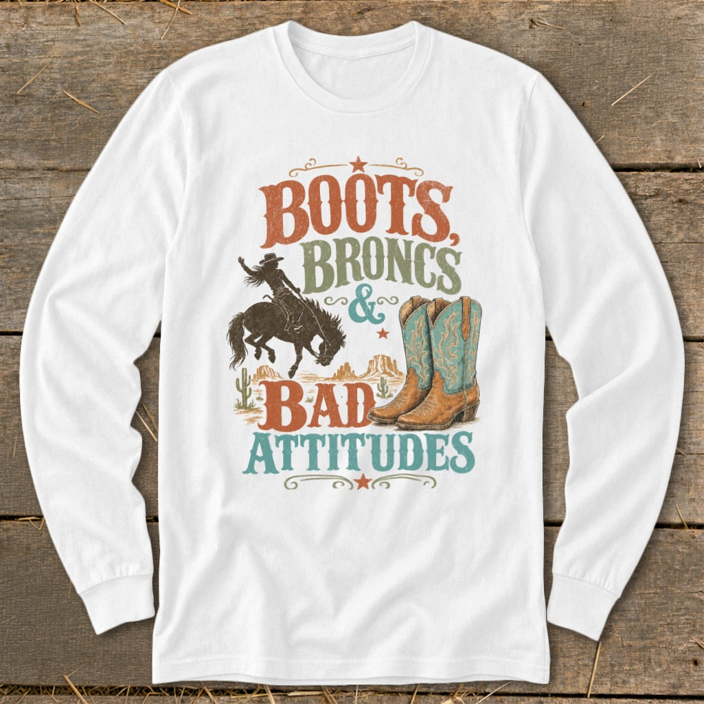 White long sleeve shirt with "Boots, Broncs & Bad Attitudes" graphic.