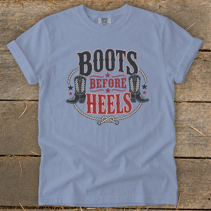 Light blue t-shirt with "Boots Before Heels" graphic and cowboy boots.