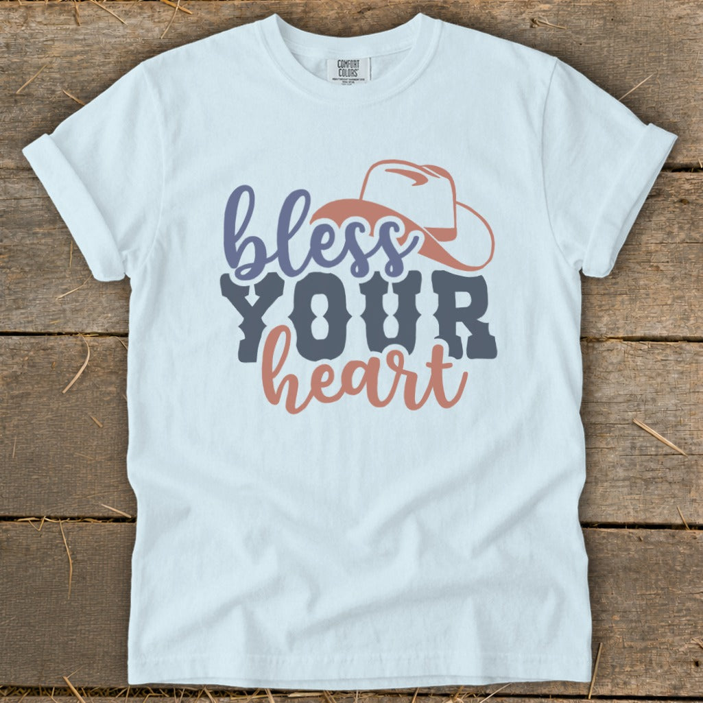 White t-shirt with "bless YOUR heart" and cowboy hat graphic.