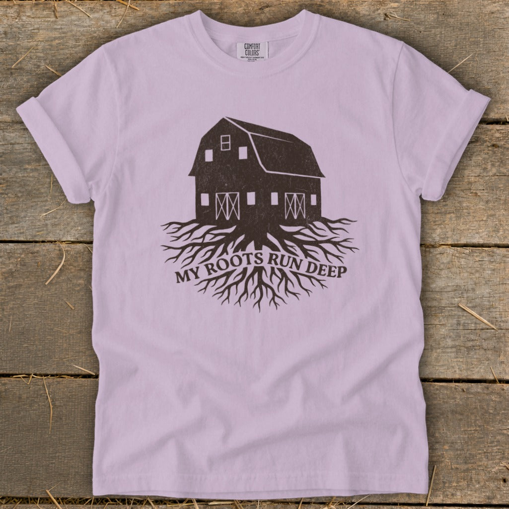 Purple t-shirt with barn and roots graphic and text "MY ROOTS RUN DEEP".