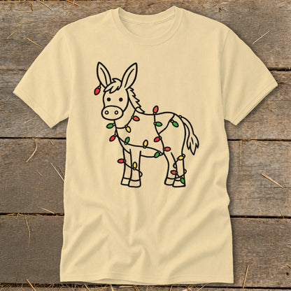 Light yellow t-shirt with a cartoon donkey wrapped in colorful Christmas lights.