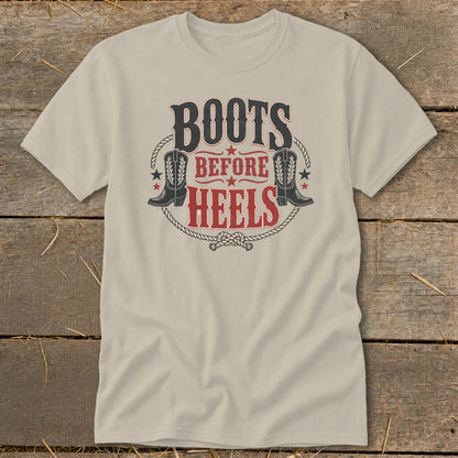 Light tan t-shirt with "BOOTS BEFORE HEELS" text and cowboy boot graphics.